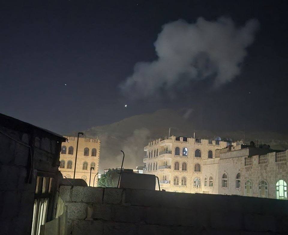 Nighttime smoke rising over a city following the Houthi strike on Saudi Arabia