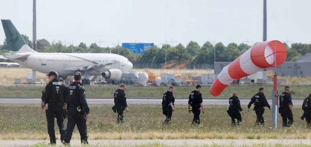 German police at Leipzig airport after the disrupted drone plot